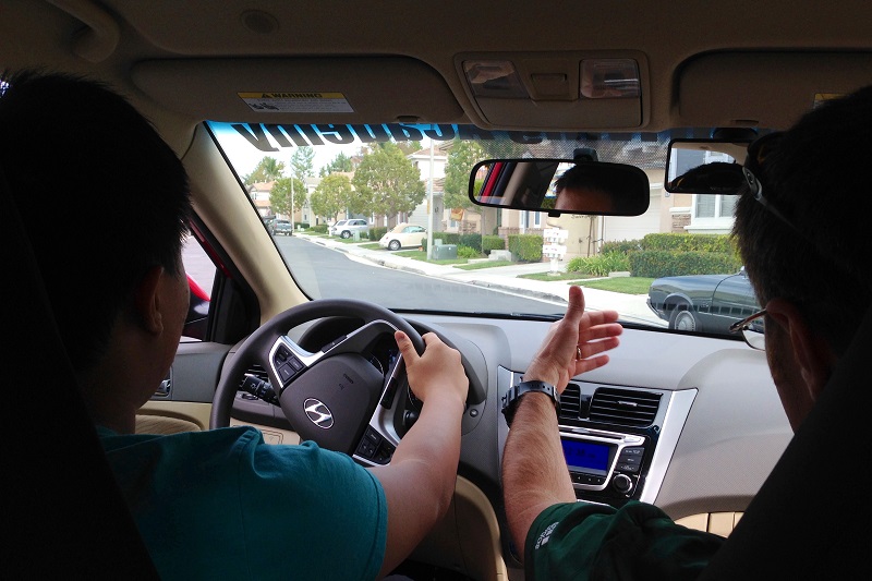 Driving Lessons in Irvine Trainer and Student Inside a Training Vehicle