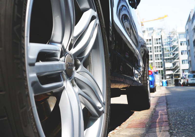 Parallel Parking in Irvine Close Up of a Front Tire of a Car Parked Along a Curb