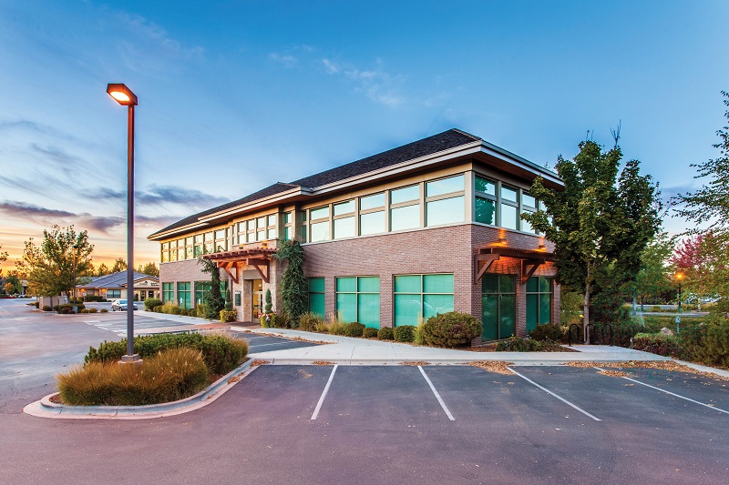 Places to Practice Driving in Corona Del Mar View of a Building with an Empty Parking Lot