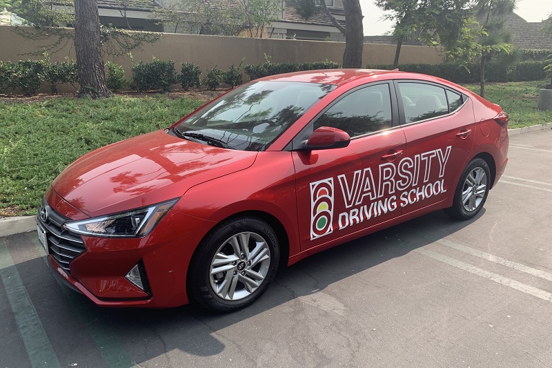 Laguna Driving School Training Vehicle Parked in a Parking Lot