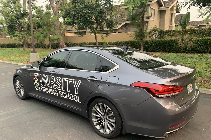 Laguna Driving School Grey Training Vehicle Parked Along a Curb