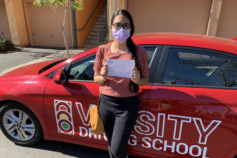 Tustin High School Drivers Ed Female Student Standing Next to a Training Vehicle