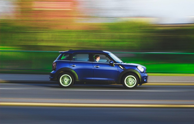 Tustin Driving Lessons Tips to Prepare a Car Speeding Down a Highway with a Blurred Background