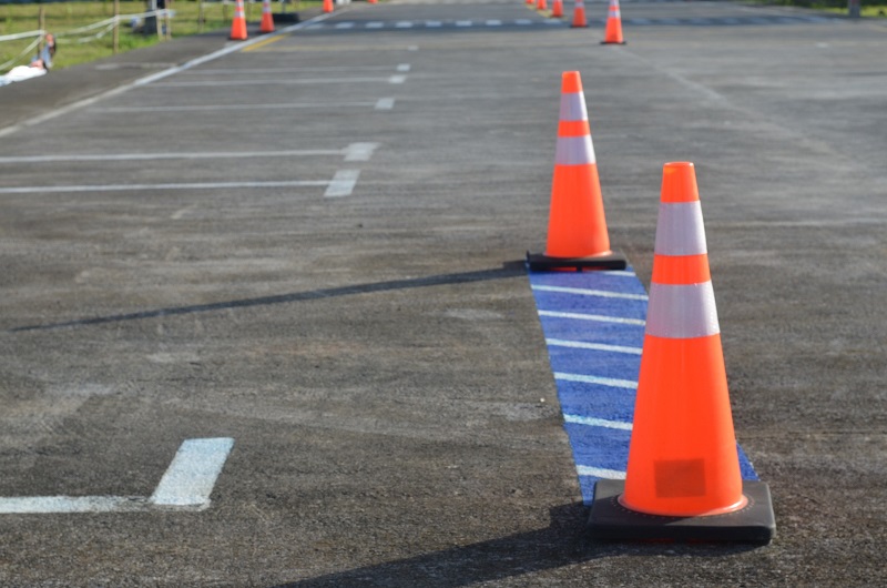 How Much are Behind the Wheel Driving Lessons in Santa Ana Close Up of Traffic Cones in a Parking Lot Making a Driving Course