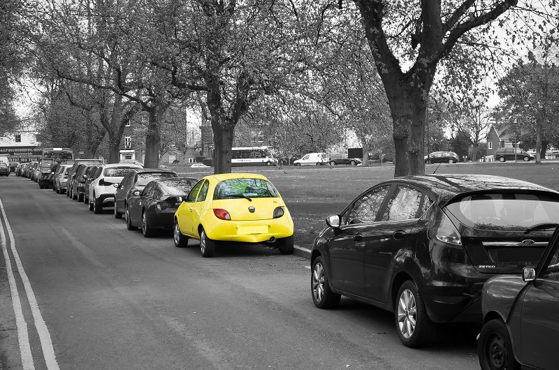 Parallel Parking Steps Black and White Photo of Cars Parked Along a Curb with One of the Cars in Color Yellow