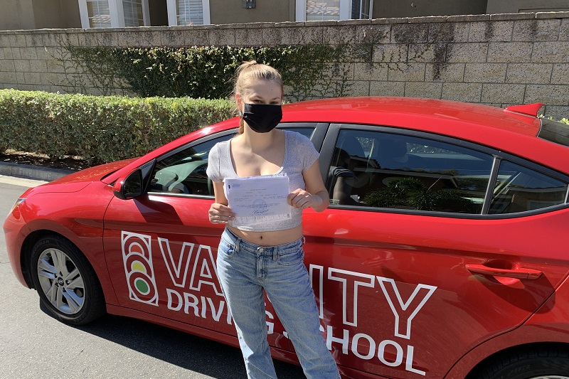 Best Dana Hills High School Driving School Student Standing Next to a Training Vehicle