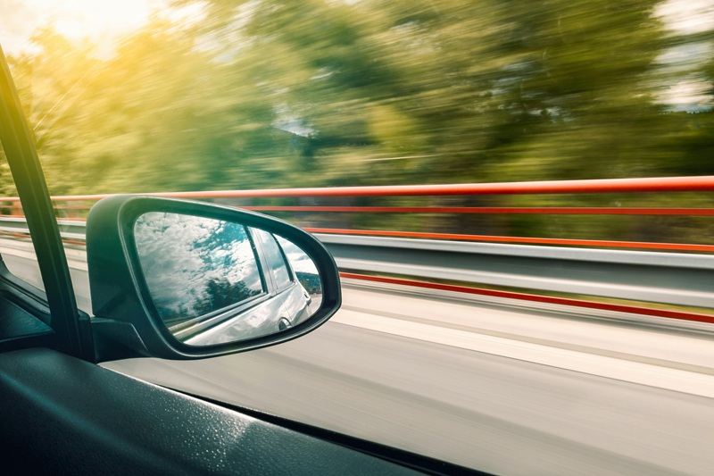 Best Dana Hills High School Behind the Wheel Training a Side View Mirror with a Blurred background of a Highway