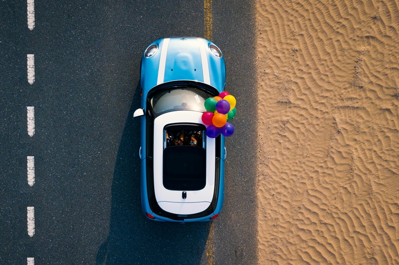 Best Dana Hills High School Behind the Wheel Training Overhead View of a Blue Mini Cooper with Balloons Coming From the Open Sun Roof