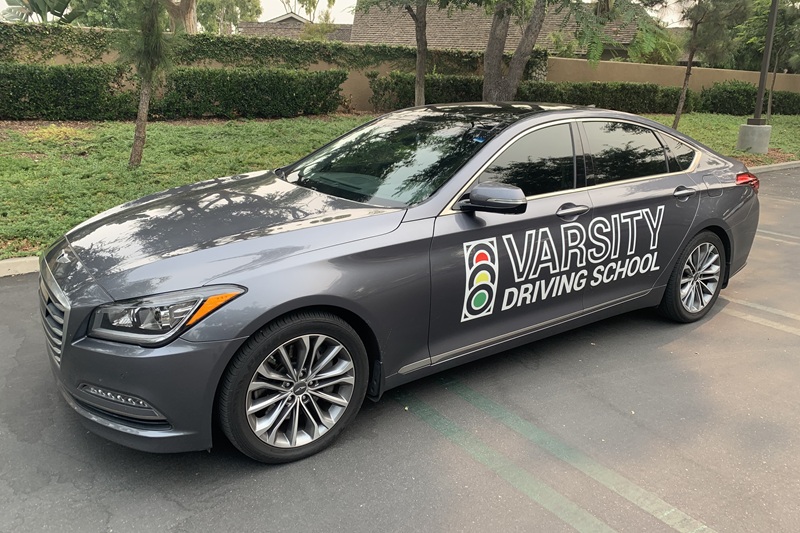 Which Adult Driving School is Best in Irvine Gray Training Vehicle in a Parking Lot
