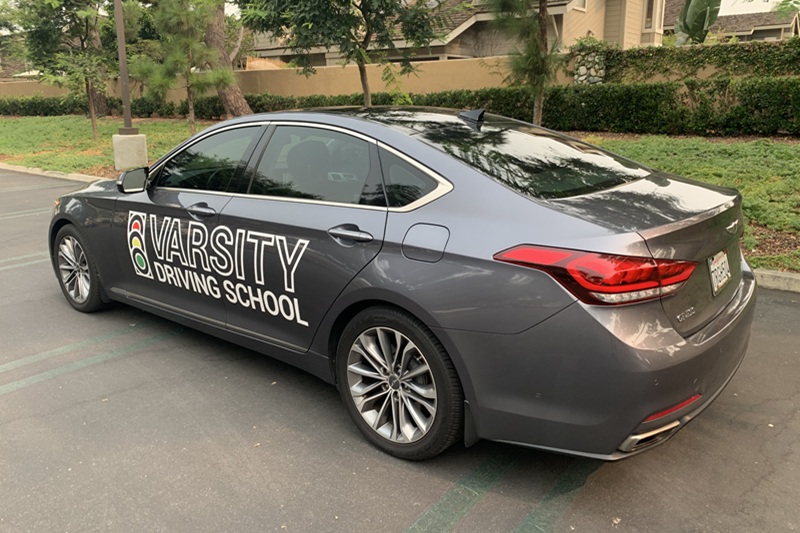 Which Adult Driving School is Best in Newport Beach Training Vehicle Parked in a Parking Lot