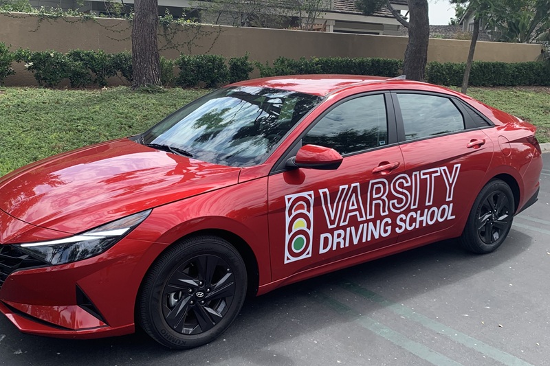 Best John F. Kennedy High School Driving School Training Vehicle Parked in a Parking Lot
