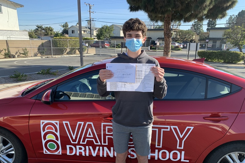 Best Century High School Driving School Student Standing Next to a Training Vehicle Parked Outside